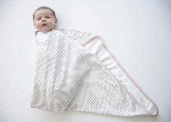 How to soothe crying babies with swaddling and white noise
