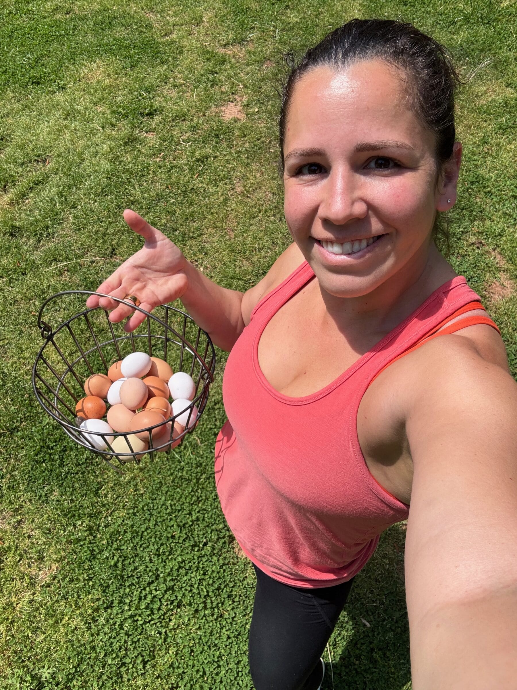 My wife Kathy with a basket full of fresh eggs from our hens.