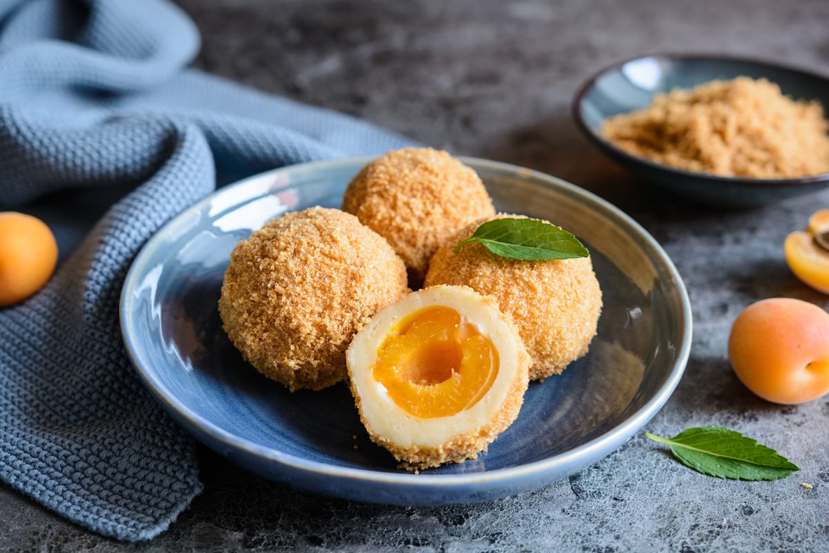 My mom always makes Marillenknödel, a traditional Austrian dish comprised of sweet dumplings stuffed with apricot and coated with breadcrumbs.