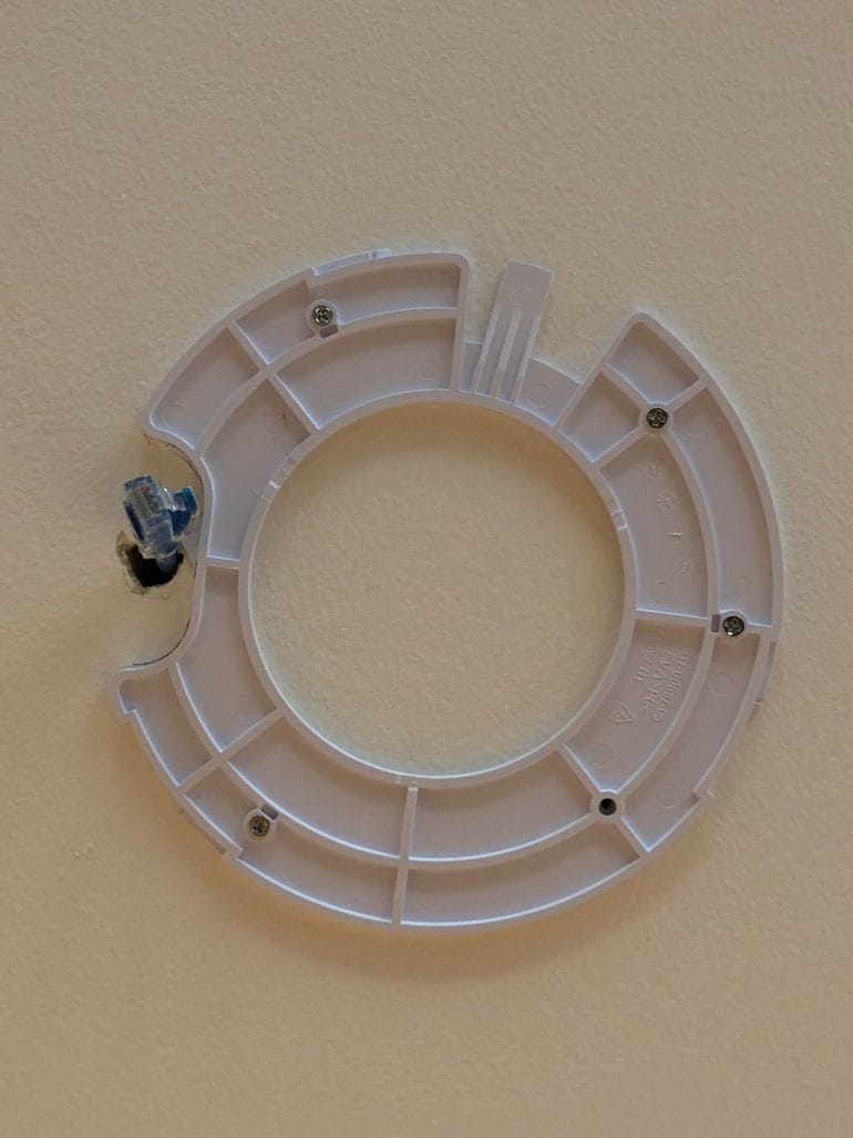 UniFi AP mounting bracket on the ceiling