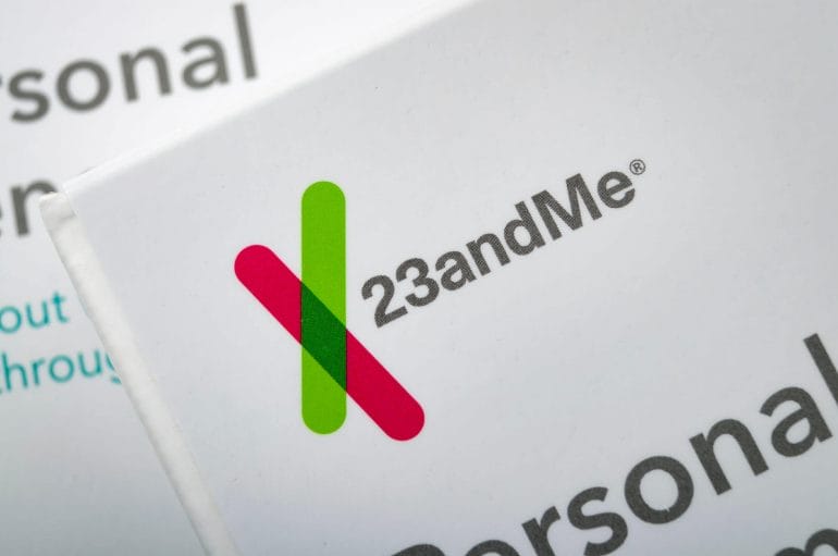 Illustrative editorial of two personal genome saliva collection kits - 23andMe