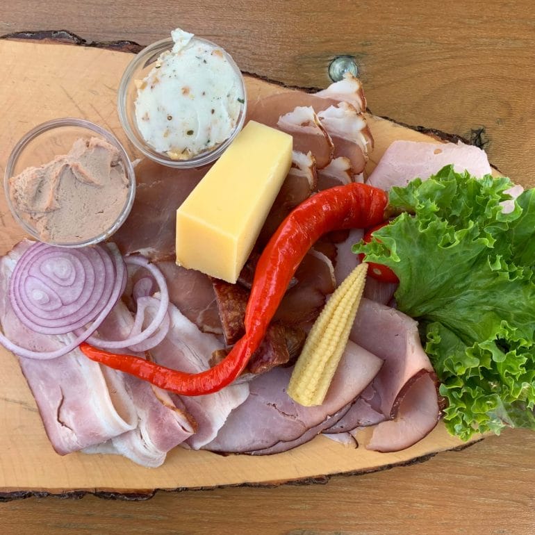 Platter with cold cuts, raw cheese, pate and pork fat