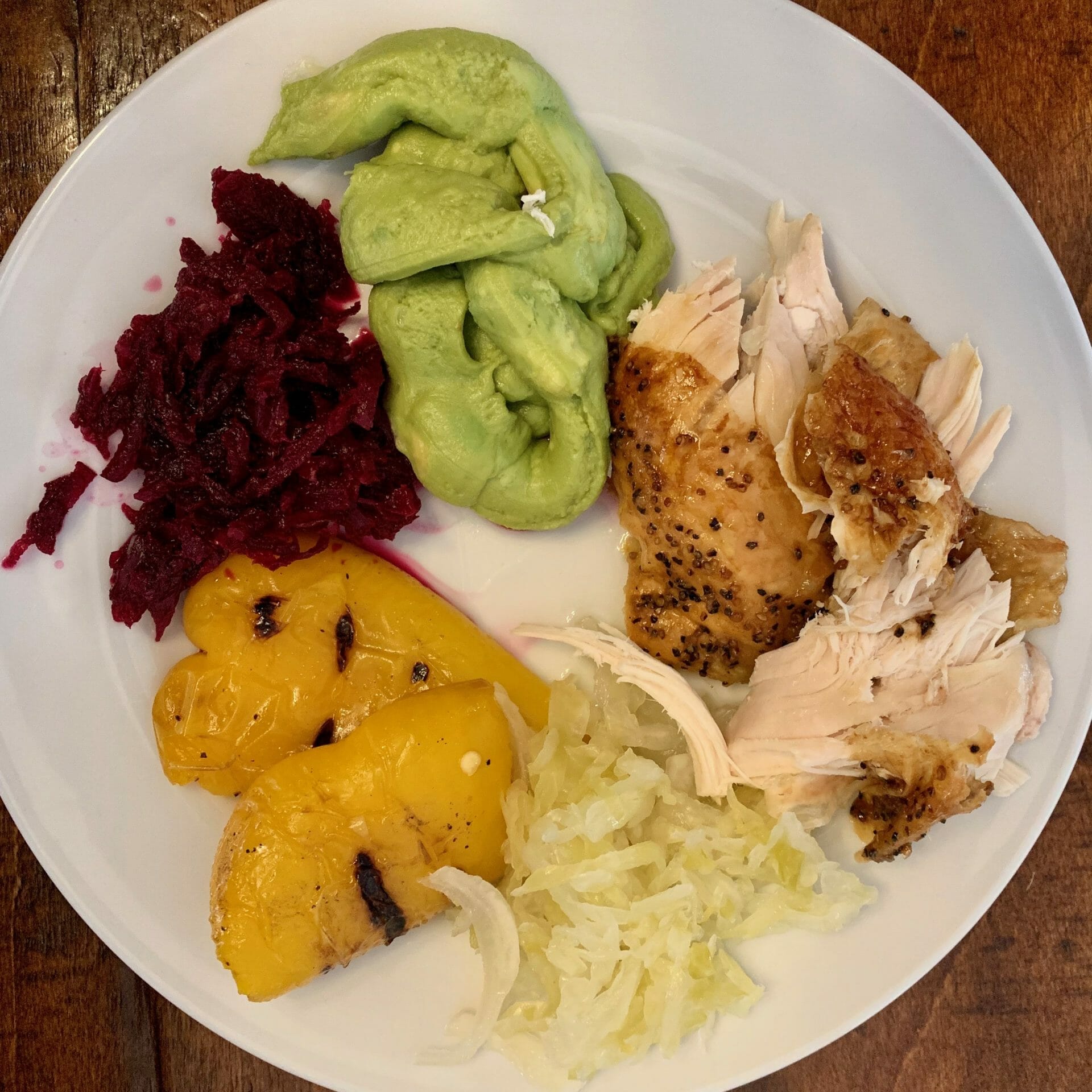 Organic rotisserie chicken (Whole Foods) with grilled peppers, fermented red beets, sauerkraut and guacamole (Costco)