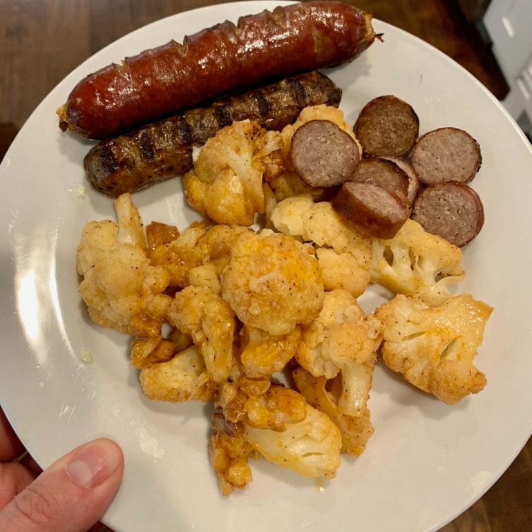 Chicken and beef sausages with fried cauliflower