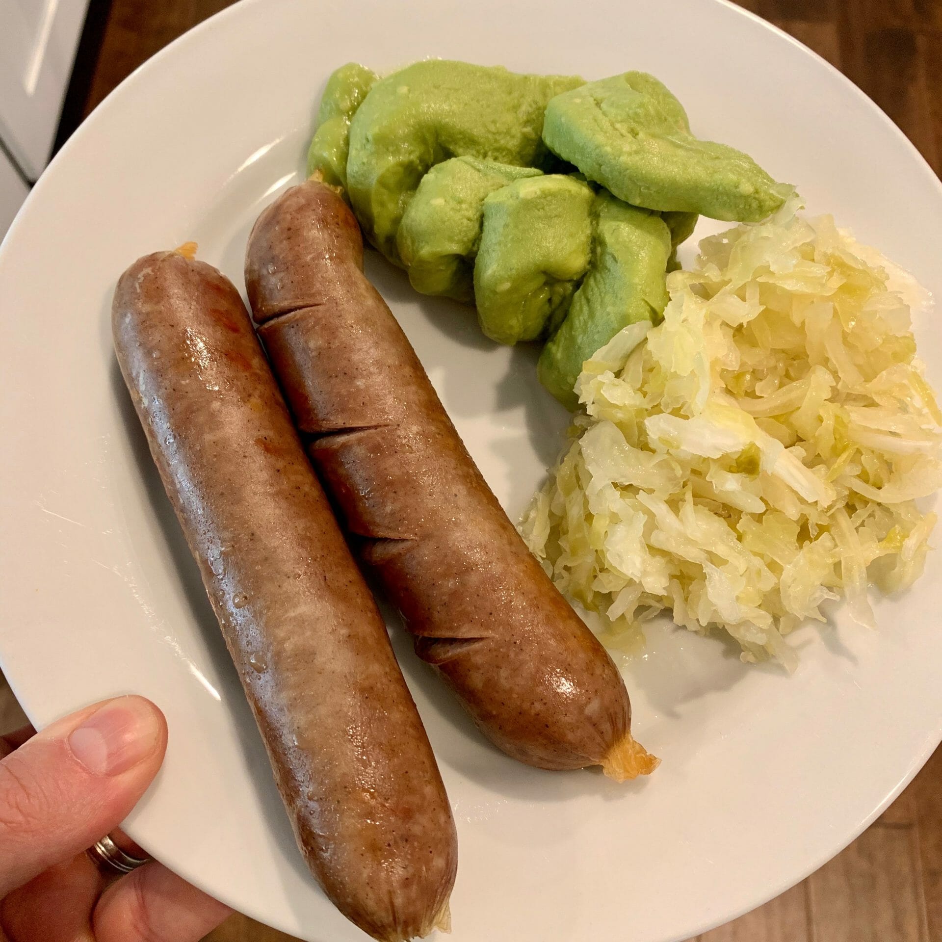 Beef sausages with sauerkraut and guacamole