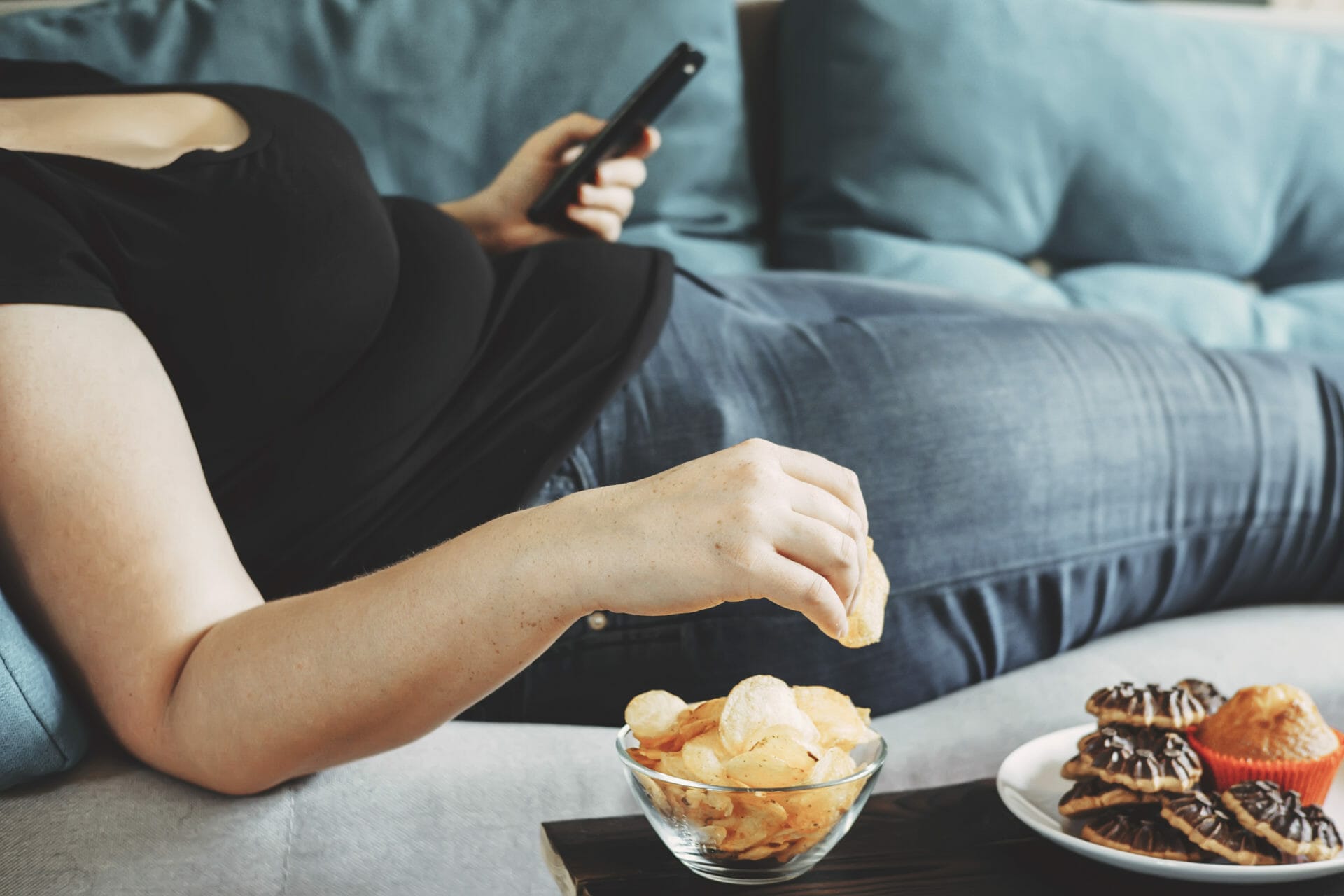 Woman overeating snacks