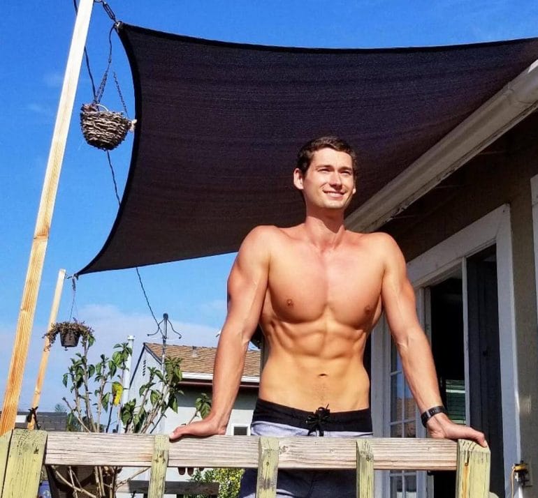 Ryan Kennedy Sunbathing on a porch