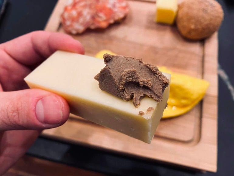 Homemade liver pate on raw cheese.