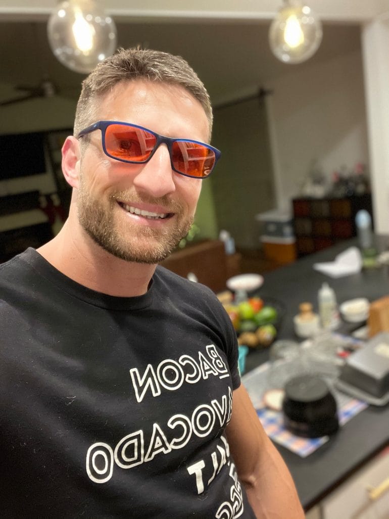 Michael wearing blue light blocking glasses