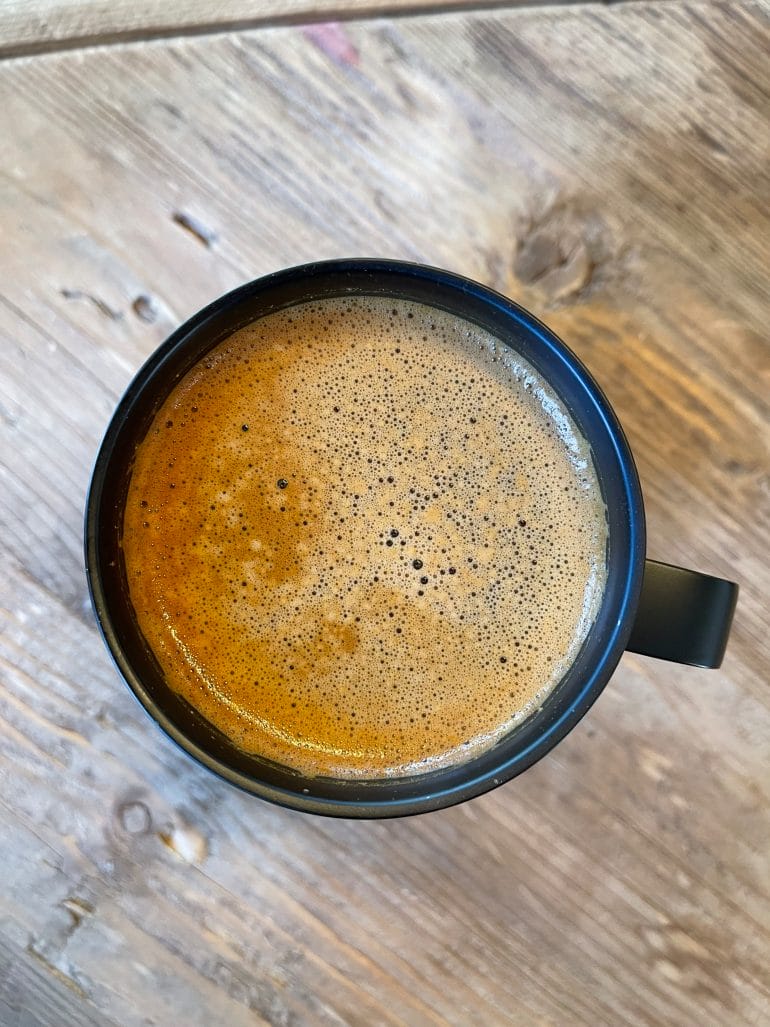 A top view of a mug full of MUD\WTR.