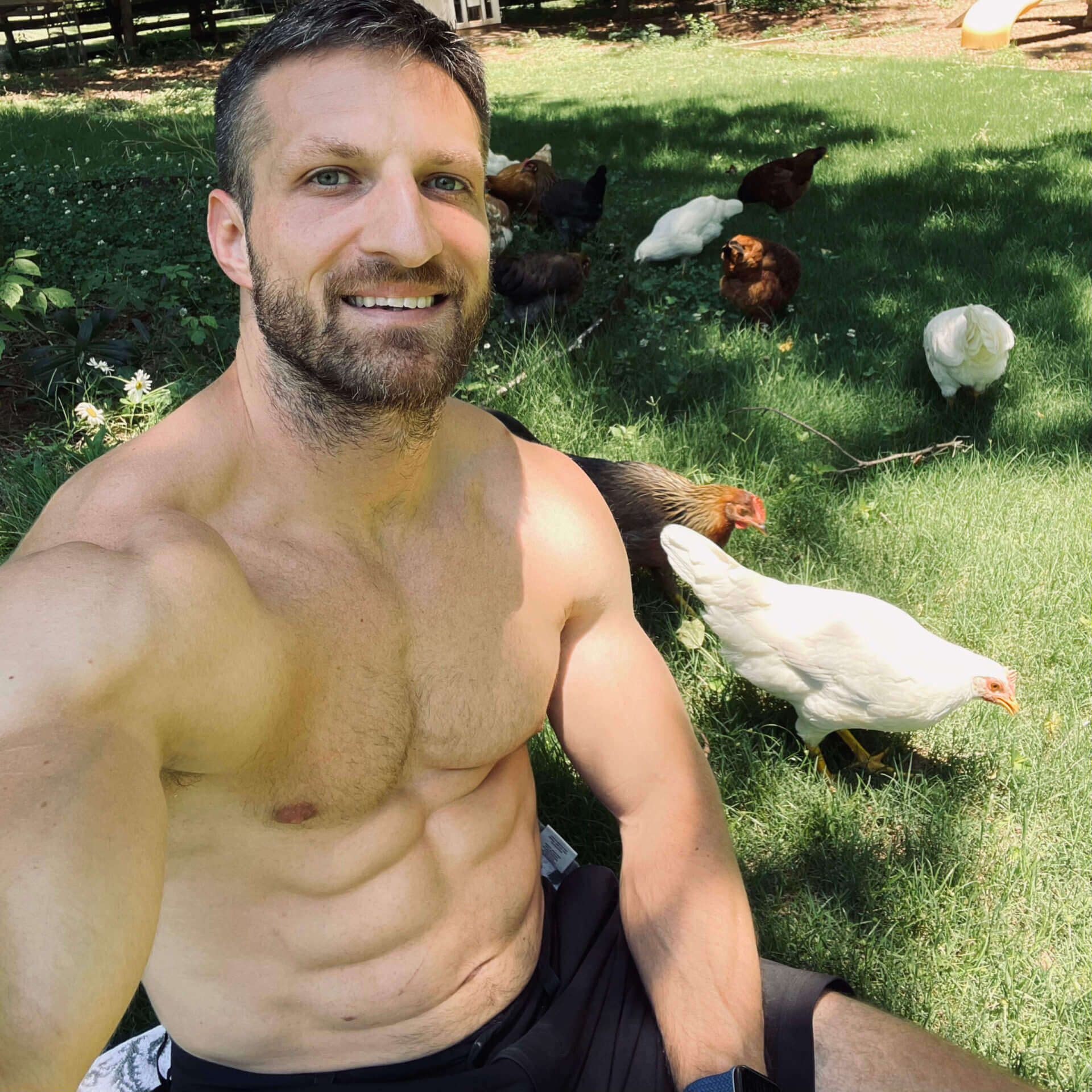 Michael hanging out with his chickens.