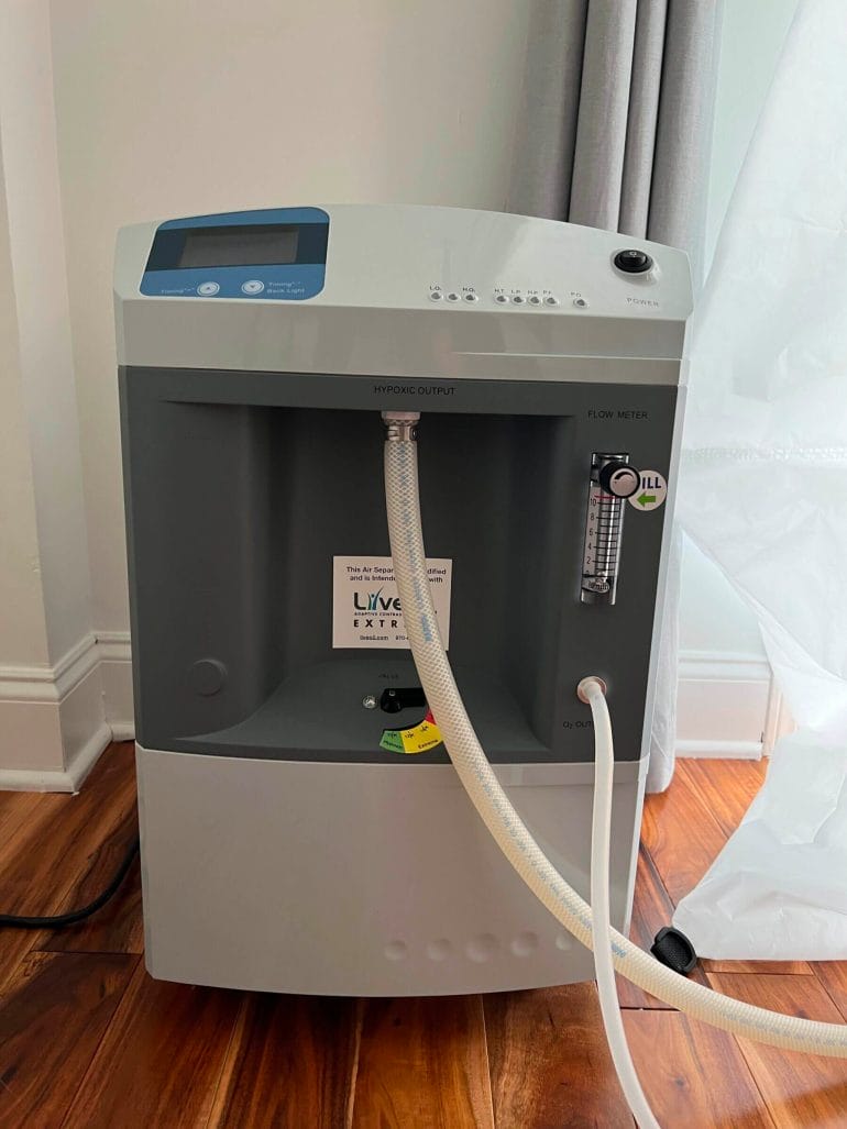 The larger tube of the LiveO2 Extreme oxygen concentrator pumps hypoxic air into the reservoir.