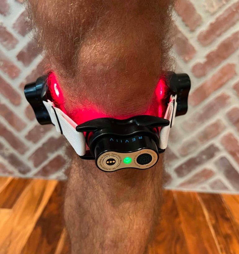 A photobiomudulation device attached to Michael's leg.
