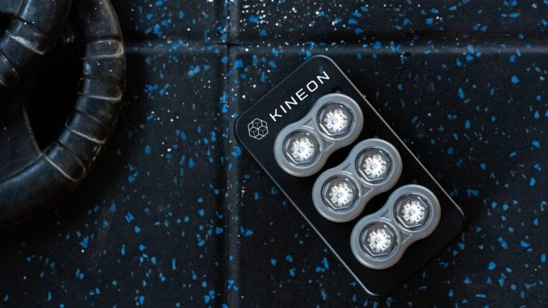 The magnetic charging dock with charging indicator LEDs.
