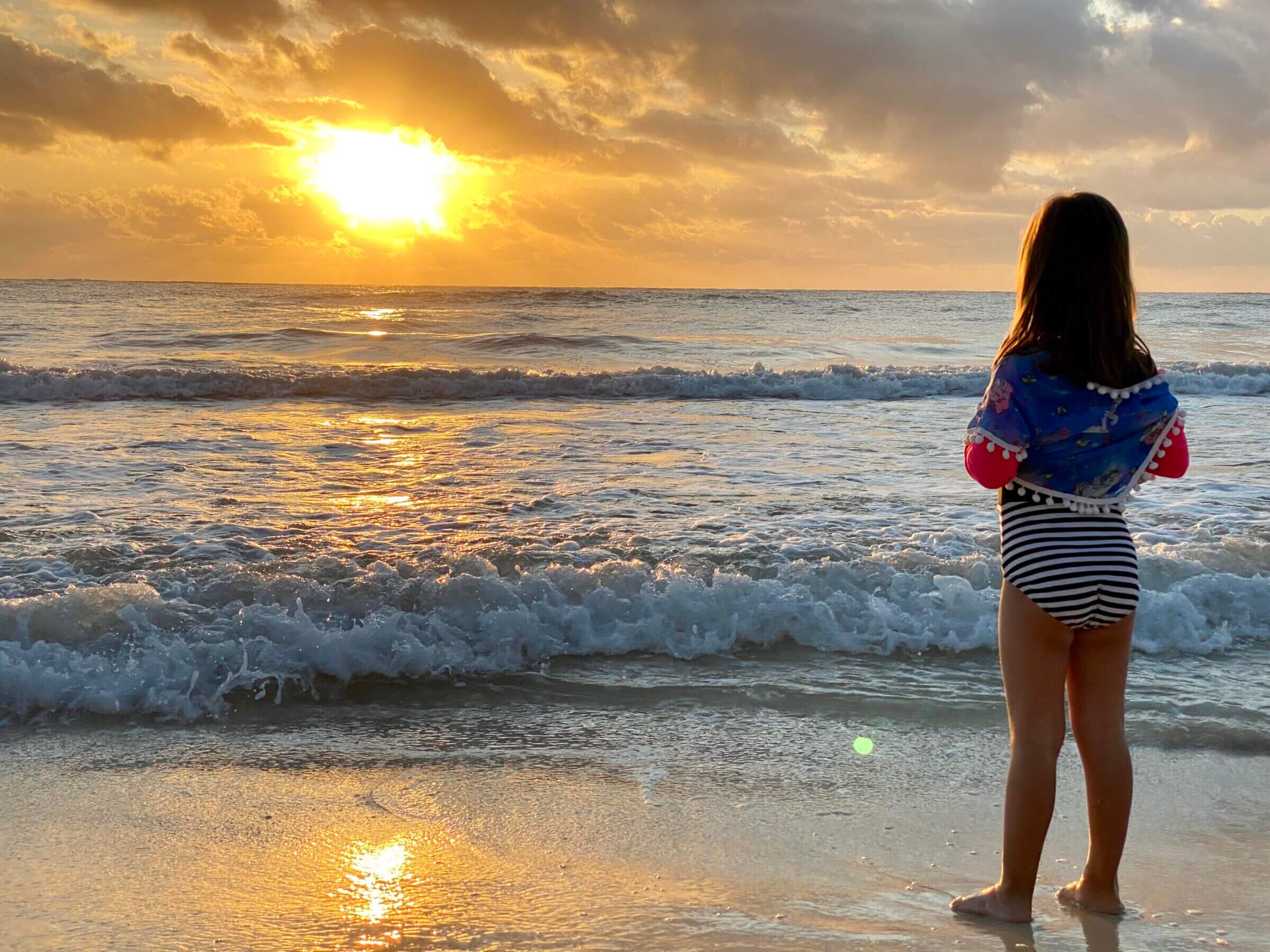 Our oldest soaking in the first rays of the sun during our vacation in Mexico in 2019