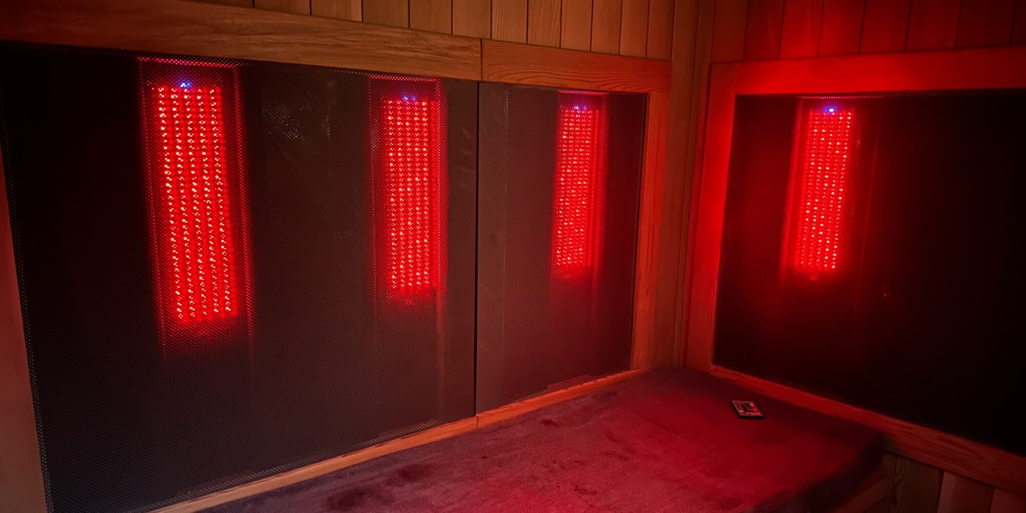 A photo of an infrared sauna that also has visible red light therapy modules.