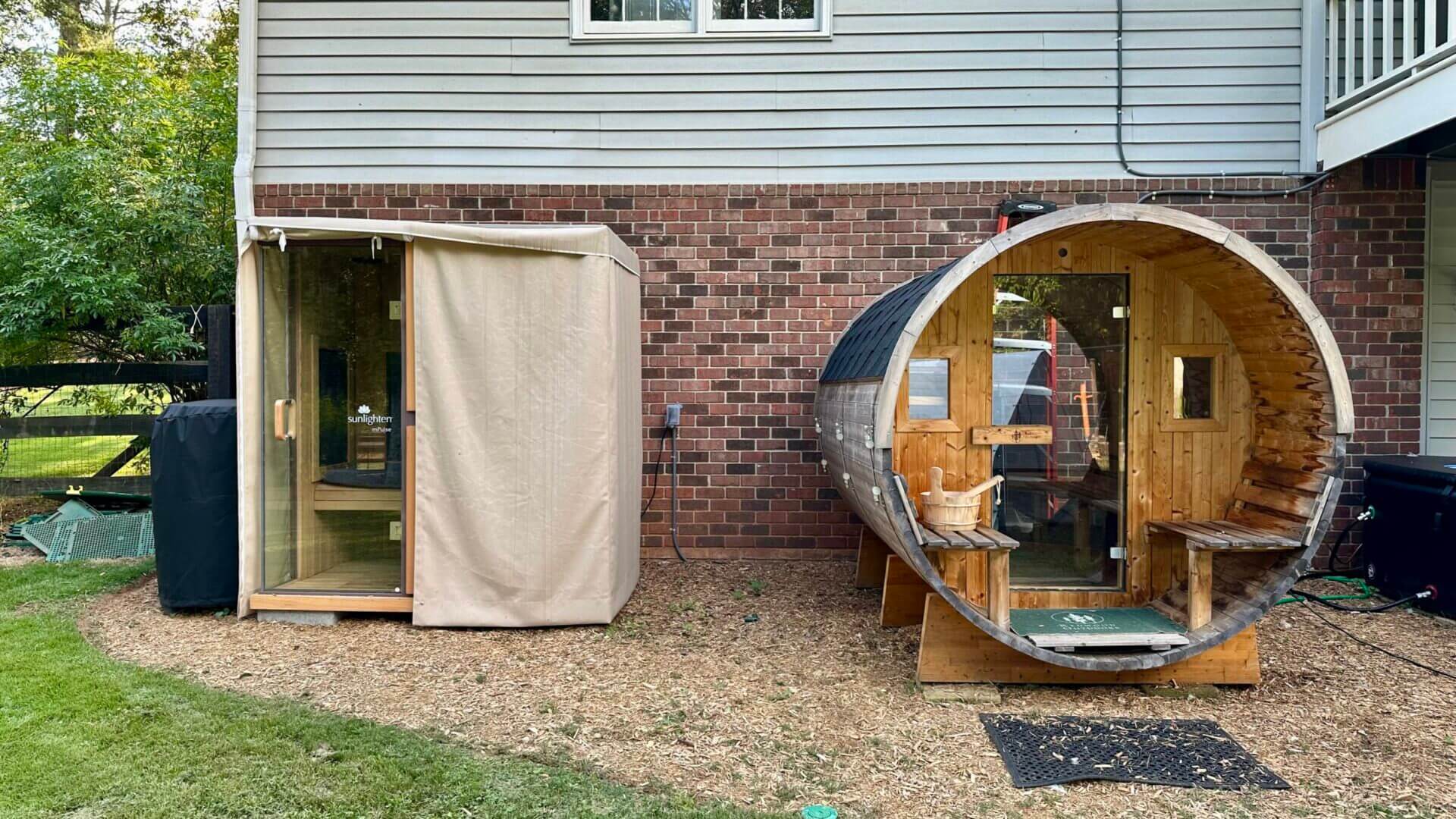 If you have the space, a walk-in sauna cabin offers an incredible sauna experience. This photo shows our Sunlighten mPulse infrared sauna (left) next to our Redwood Outdoors steam sauna (right). We use them both!