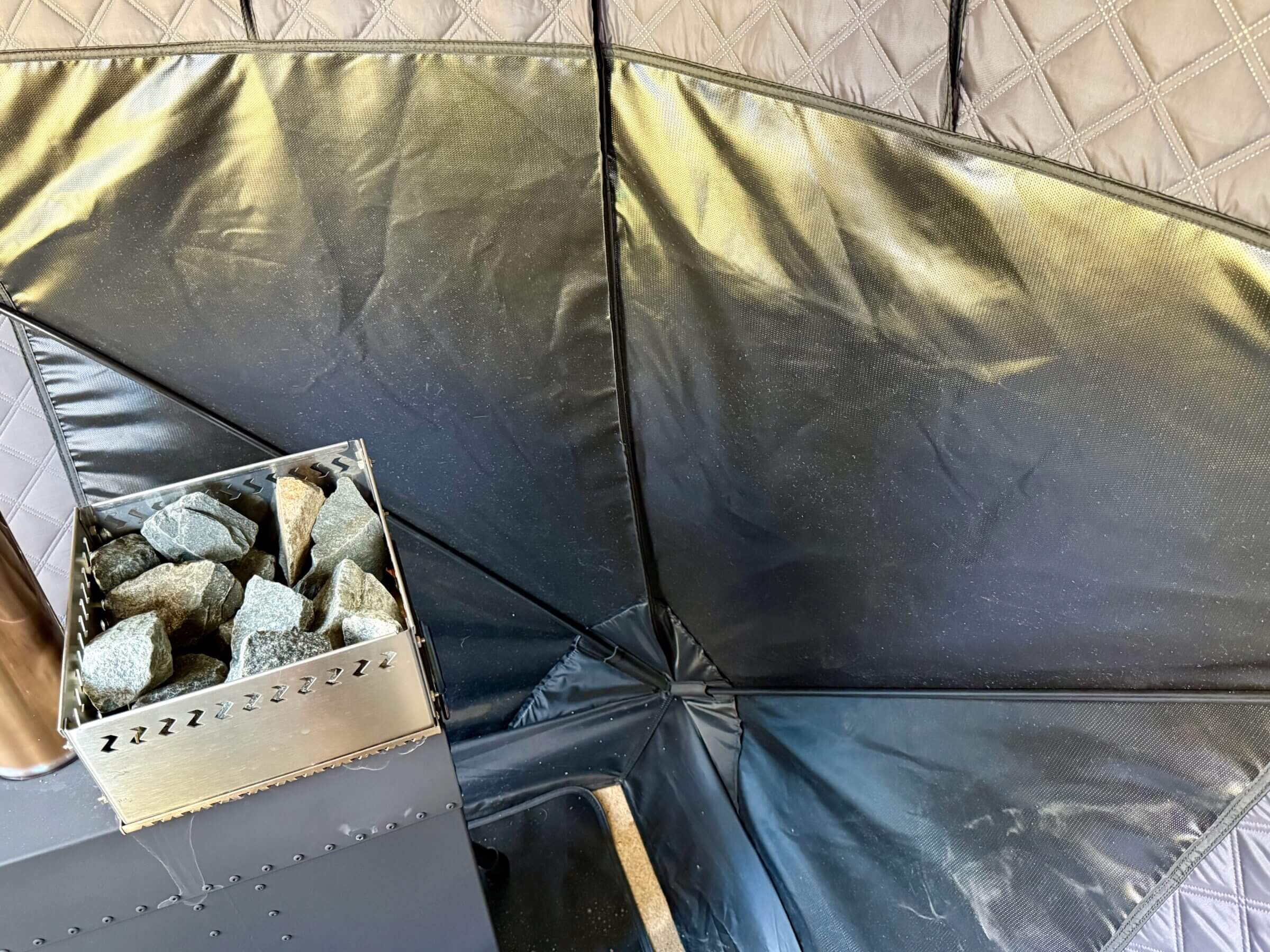 Heat-resistant fabric protects the tent near the stove.