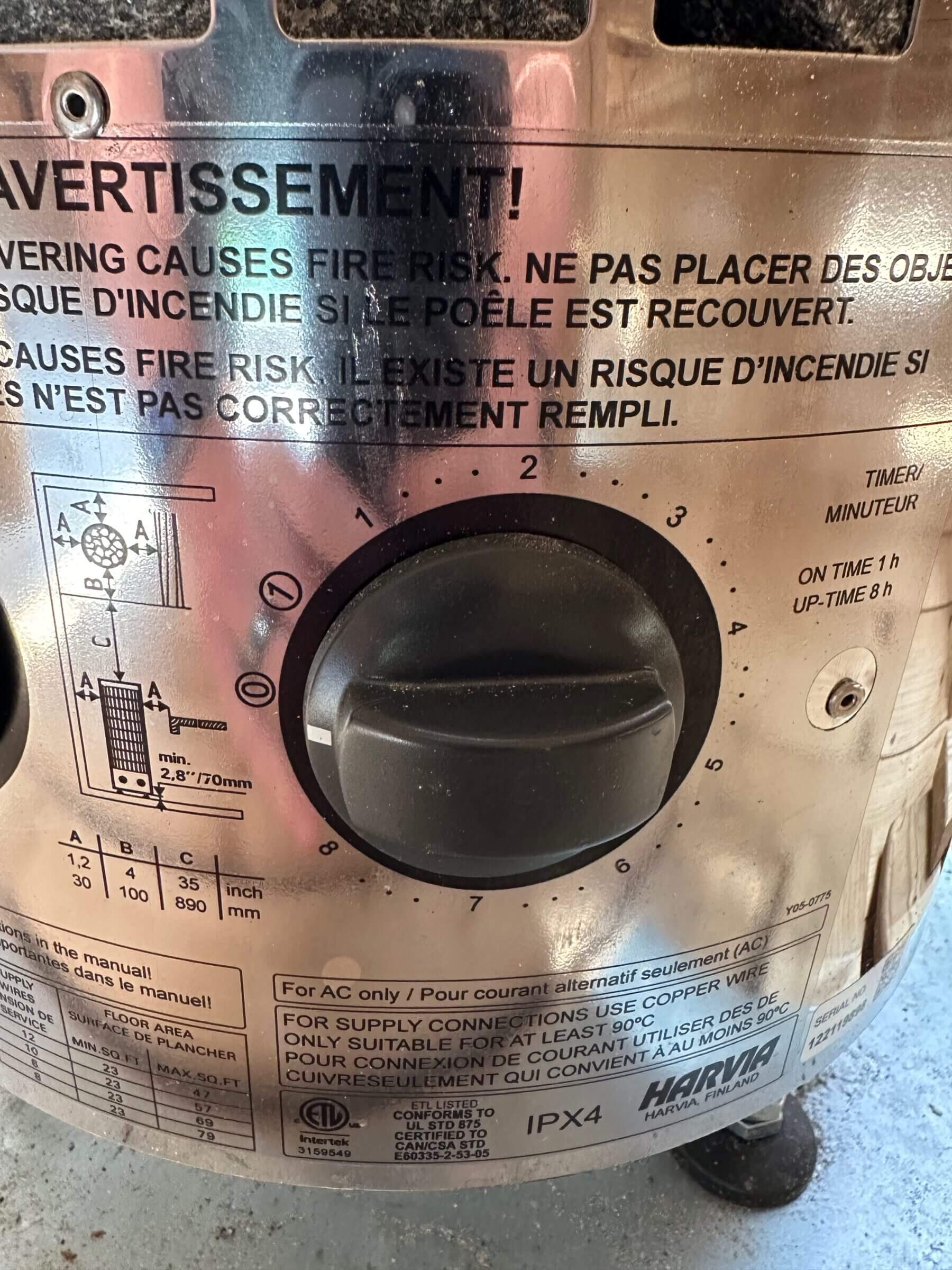The manual heat setting knob on the Harvia sauna heater.